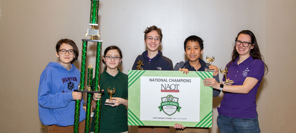 Hunter College High School A with their first-place trophy from the 2019 Middle School National Championship Tournament